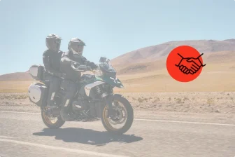 riders on motorcycle in equipment